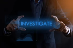 A man appears to be holding the floating word investigations in his hand