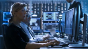 a female detective gazing at a computer screen
