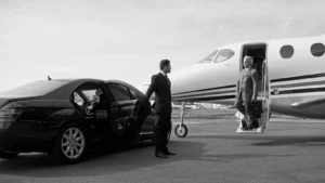 Protection officer unlocking door for a client arriving via private aircraft