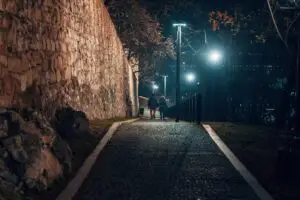 walking at night next to wall in Bratislava, Slovakia